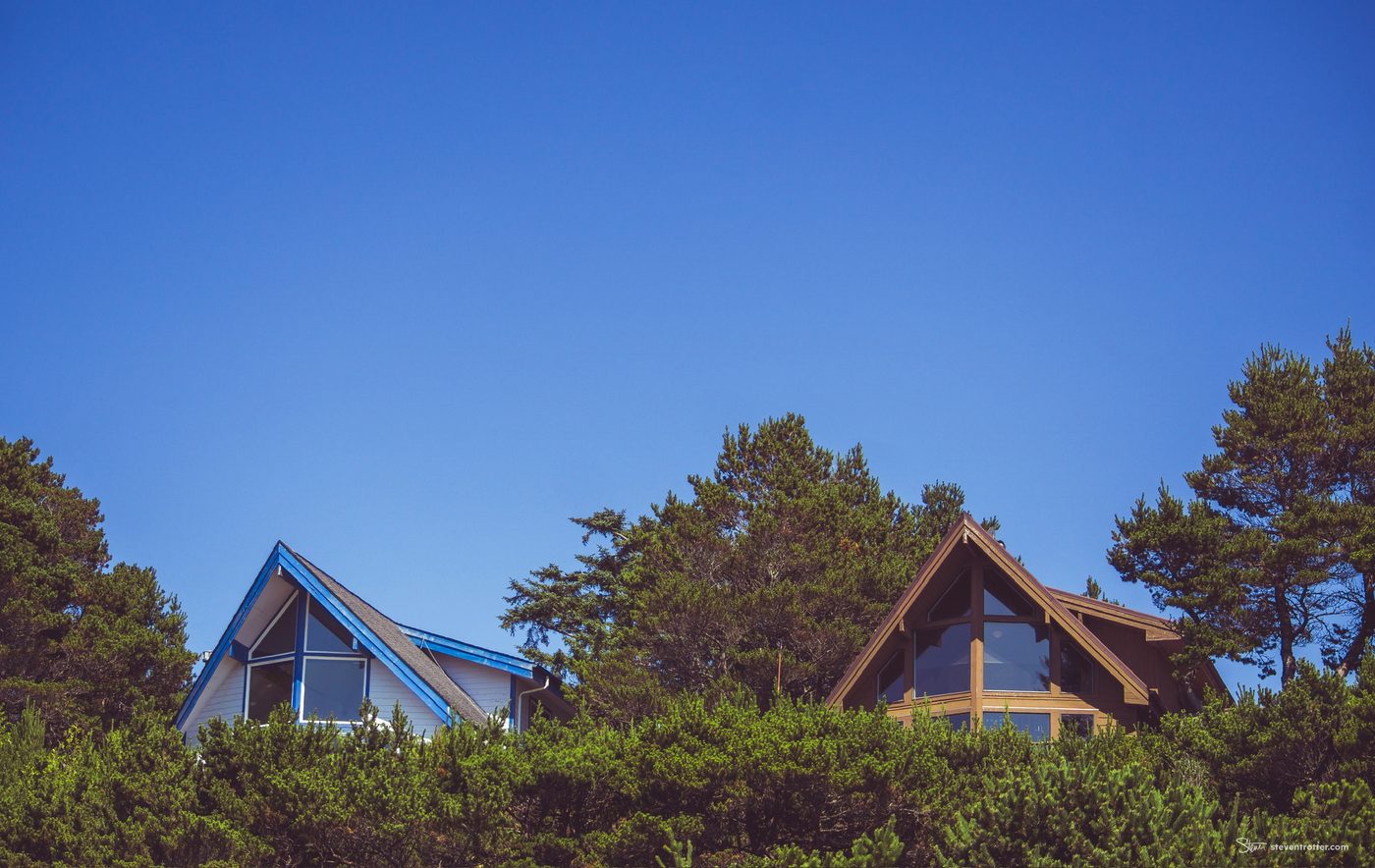 A Frame Houses Against Blue Sky.